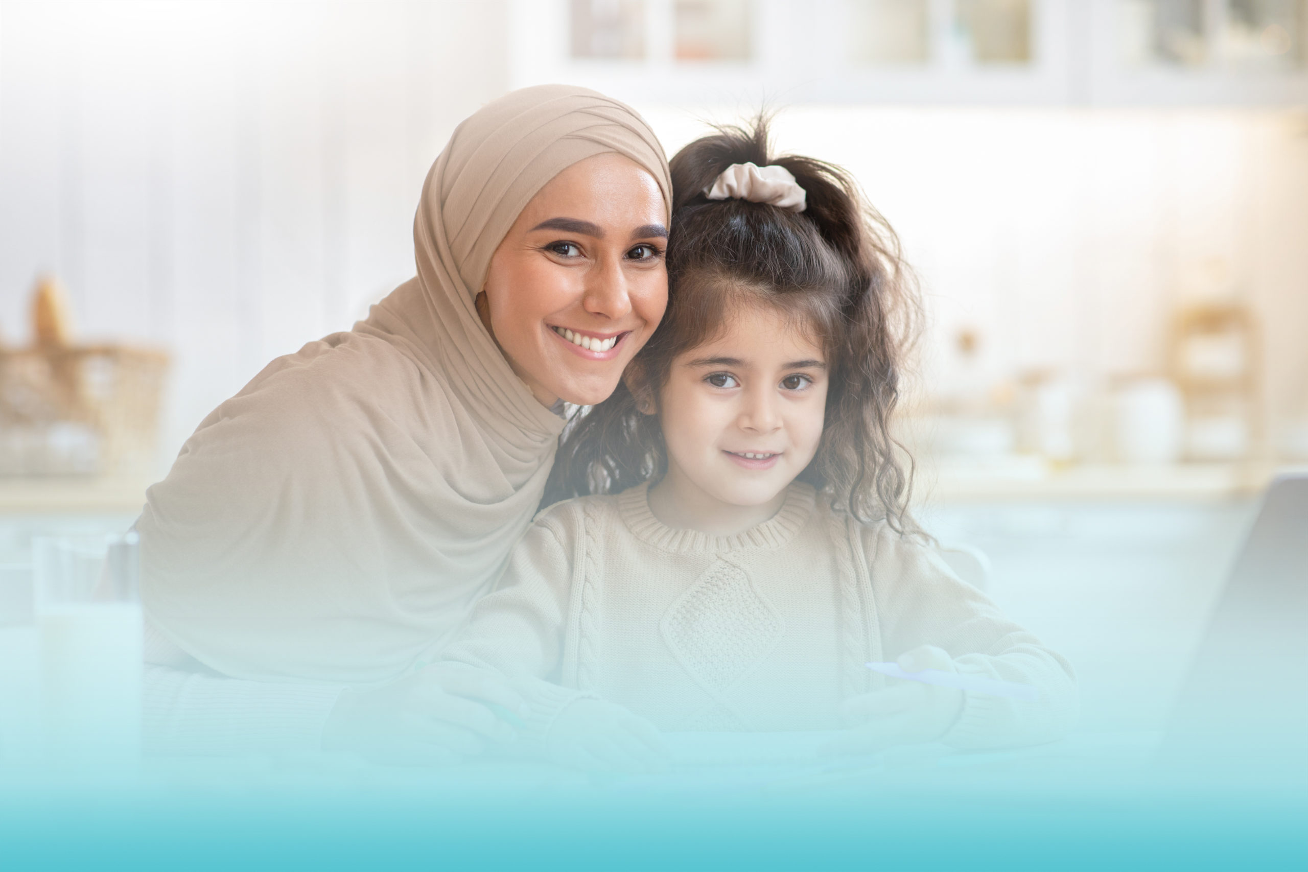 Portrait Of Happy Muslim Mom And Little Daughter Posing In Kitchen Interior While Having Fun Together At Home, Cheerful Family Sitting At Table And Drawing With Colorful Pencils, Smiling At Camera
