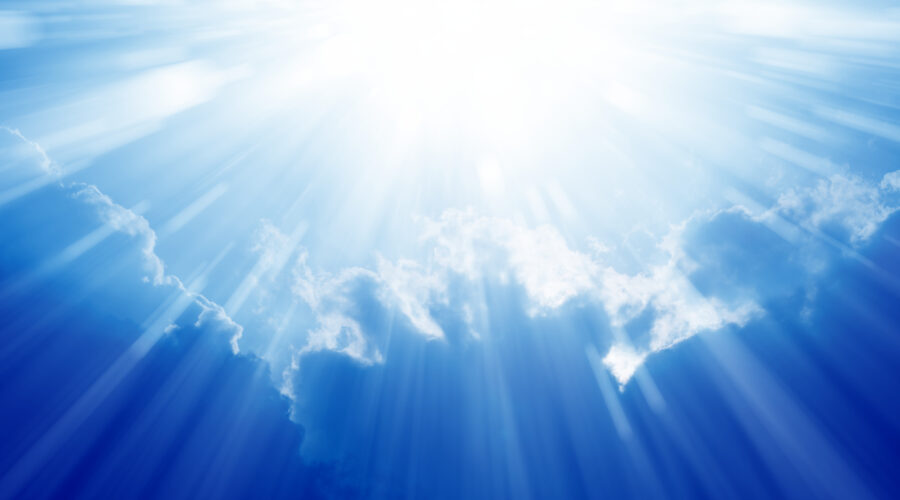 Peaceful background – beautiful blue sky with bright sun, light from heaven